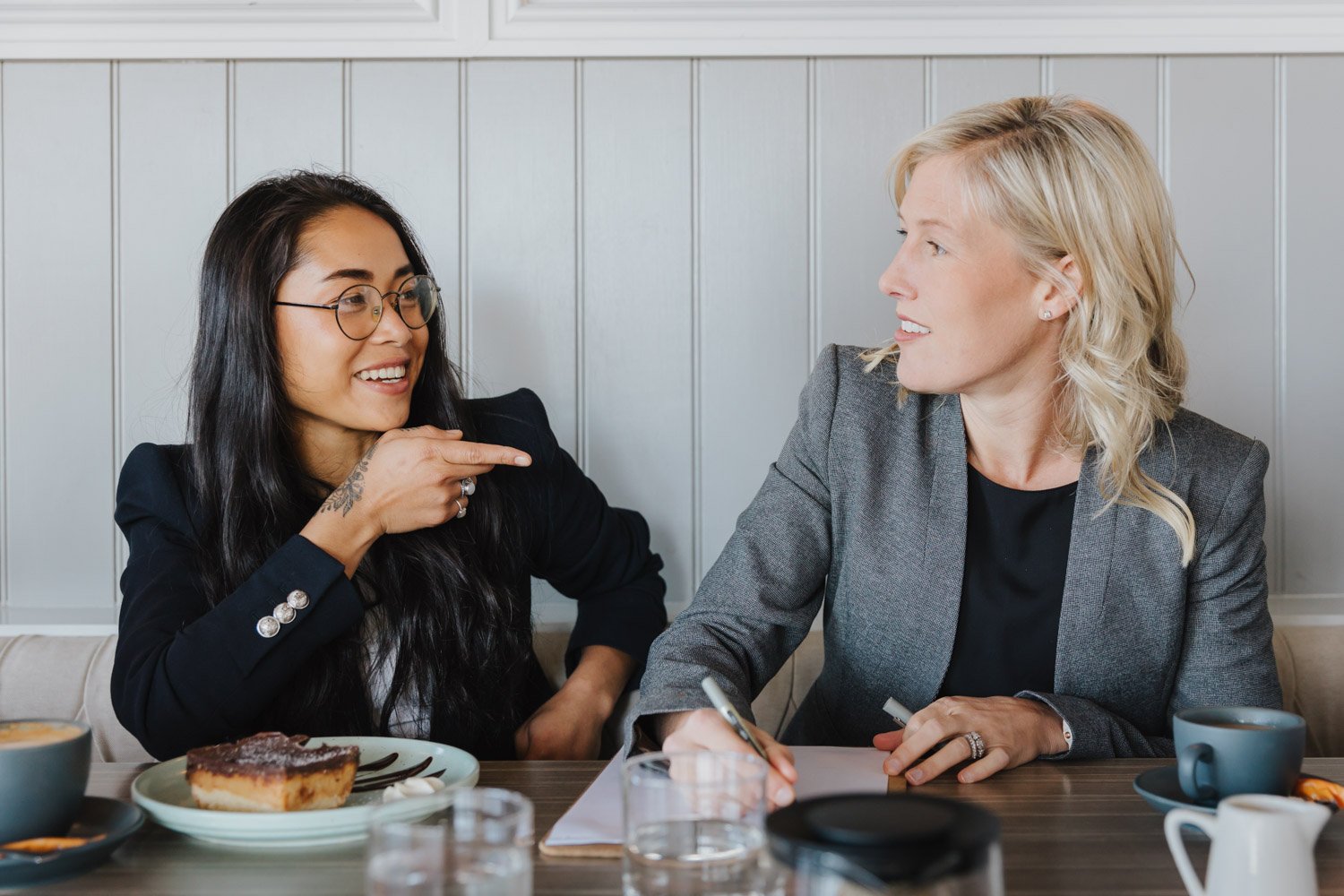 Sarah Beaton (Director, Marlston Forrest) is a qualified CPA and Financial Planner. She is in a meeting with a female client in a café.