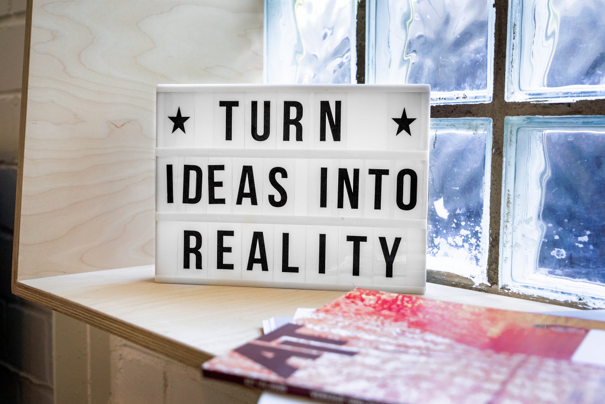 A sign saying ‘turn ideas into reality’.